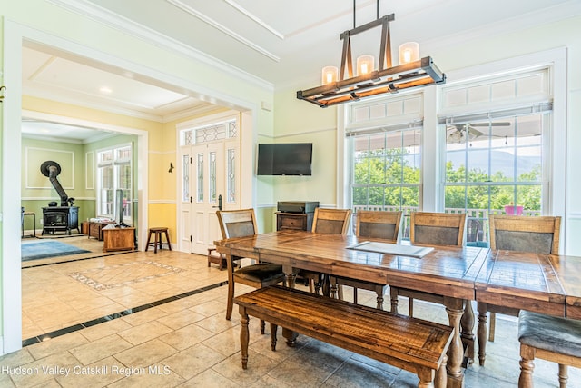 208 Paul Saxe Rd, Catskill, NY 12414 - dining space with a chandelier, a wood stove, and crown molding