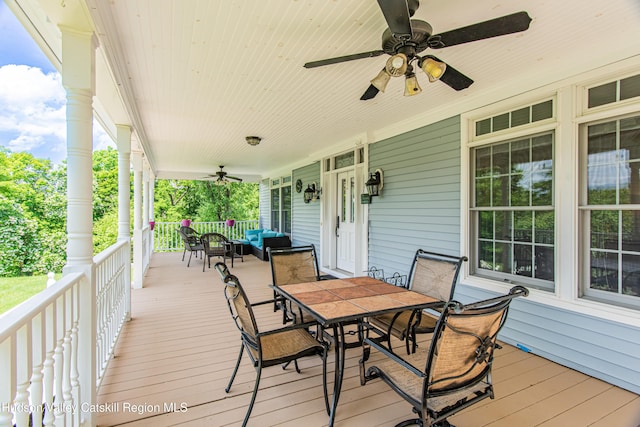 208 Paul Saxe Rd, Catskill, NY 12414 - wooden porch featuring a ceiling fan, outdoor dining area, and an outdoor living space