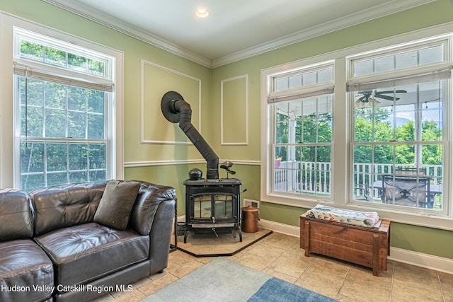208 Paul Saxe Rd, Catskill, NY 12414 - living area featuring a wood stove, crown molding, a ceiling fan, light tile patterned floors, and recessed lighting