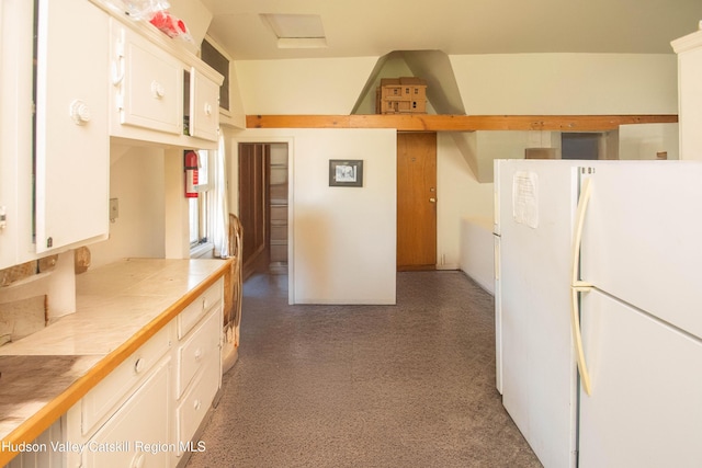 38 Plattekill Ave, New Paltz, NY 12561 - kitchen featuring freestanding refrigerator, tile counters, and white cabinets