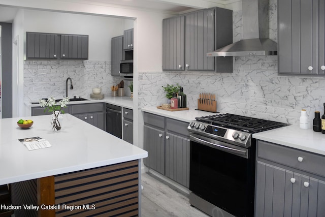 4947 Rte 32, Catskill, NY 12414 - kitchen featuring gray cabinets, wall chimney exhaust hood, and appliances with stainless steel finishes