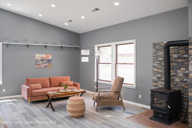 4947 Rte 32, Catskill, NY 12414 - living room with wood finished floors, a wood stove, baseboards, recessed lighting, and lofted ceiling