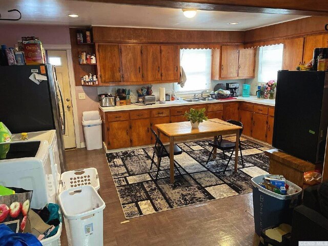 1644 Rte 9, Stuyvesant, NY 12173 - kitchen with brown cabinets, freestanding refrigerator, light countertops, and a sink