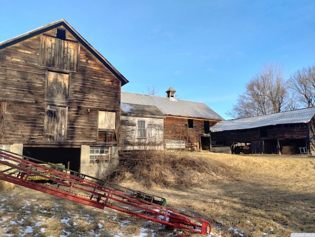 1644 Rte 9, Stuyvesant, NY 12173 - back of house with a barn, an outbuilding, metal roof, and fence