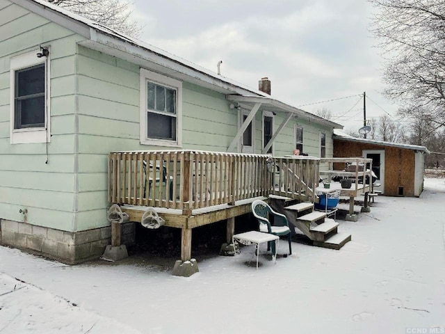 1644 Rte 9, Stuyvesant, NY 12173 - snow covered back of property with a wooden deck and a chimney