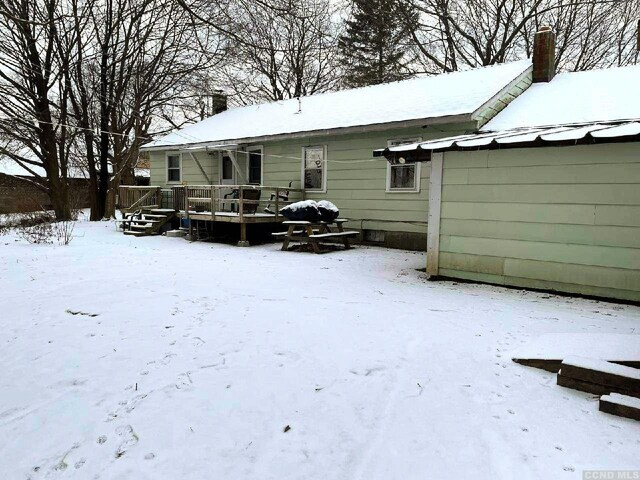 1644 Rte 9, Stuyvesant, NY 12173 - snow covered property with a wooden deck and a chimney