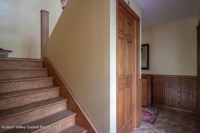 staircase with tile patterned floors