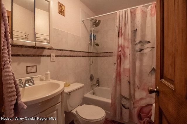 full bathroom with vanity, shower / bathtub combination with curtain, tile walls, and toilet