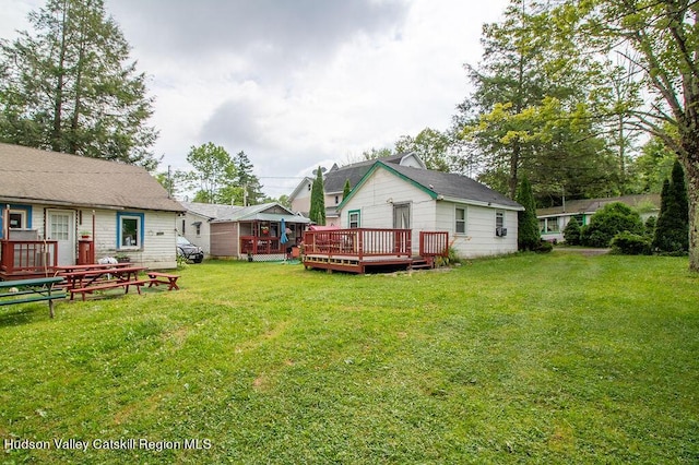 view of yard featuring a wooden deck