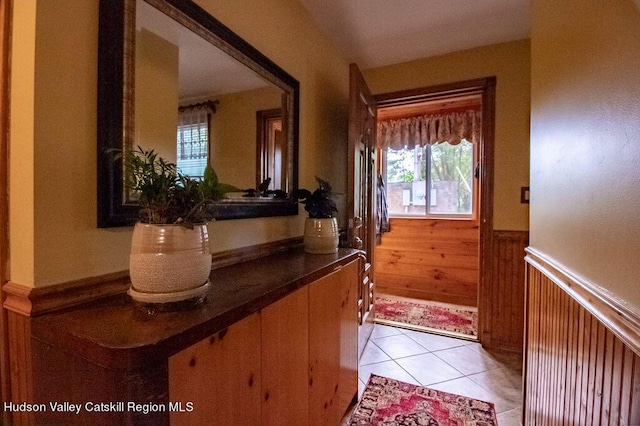 doorway to outside featuring light tile patterned floors