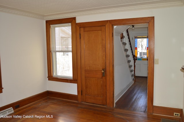 interior space with a wealth of natural light, visible vents, and stairway