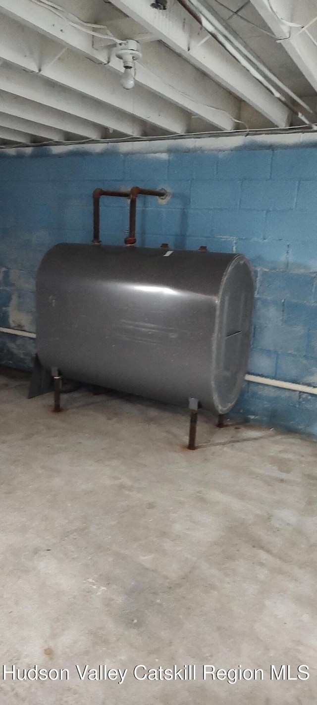 16 Lake Rd, Rensselaerville, NY 12147 - basement view of oil tank, concrete block wall, and concrete floors