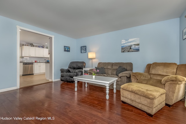 living area with dark wood-style floors and baseboards