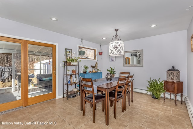 dining room with a healthy amount of sunlight, light tile patterned floors, baseboards, and recessed lighting