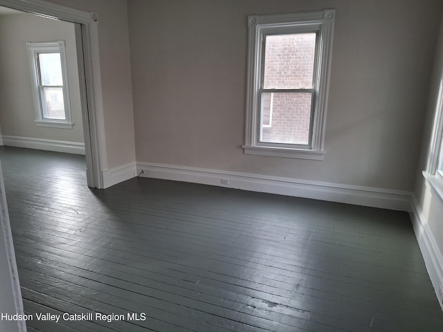 empty room featuring dark hardwood / wood-style floors