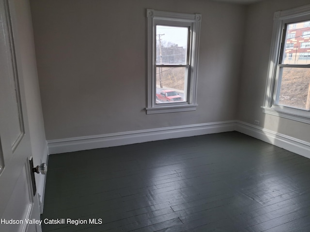 unfurnished room featuring dark hardwood / wood-style floors