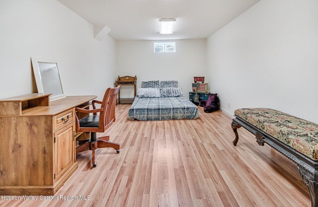 825 County Route 403, Greenville, NY 12083 - bedroom with light wood-style floors, an office area, and baseboards