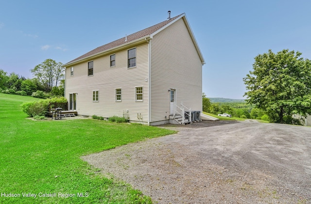 825 County Route 403, Greenville, NY 12083 - view of home's exterior featuring a yard, entry steps, and cooling unit