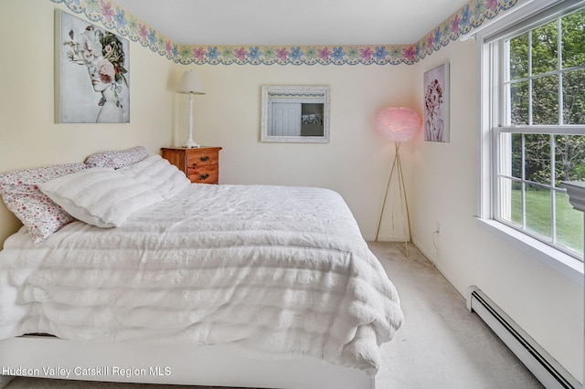 825 County Route 403, Greenville, NY 12083 - carpeted bedroom with a baseboard radiator and multiple windows
