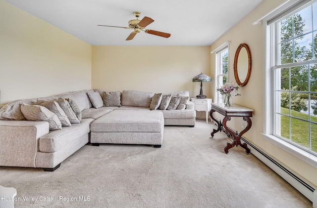825 County Route 403, Greenville, NY 12083 - carpeted living area featuring plenty of natural light, baseboard heating, and ceiling fan