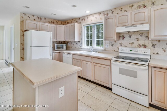 825 County Route 403, Greenville, NY 12083 - kitchen with white appliances, under cabinet range hood, a sink, a baseboard radiator, and light tile patterned floors