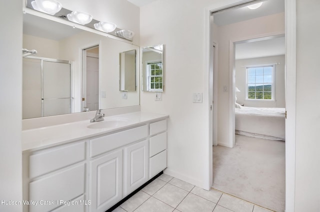 825 County Route 403, Greenville, NY 12083 - bathroom featuring ensuite bathroom, vanity, tile patterned floors, a shower with shower door, and baseboards