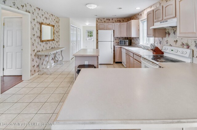825 County Route 403, Greenville, NY 12083 - kitchen featuring white appliances, wallpapered walls, under cabinet range hood, healthy amount of natural light, and a sink