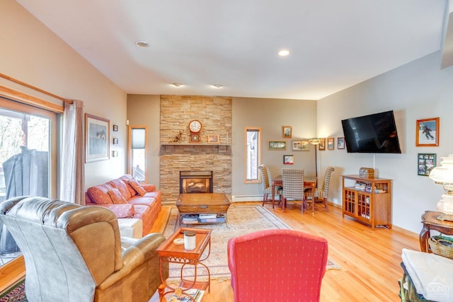 220 Botti Dr, Hunter, NY 12442 - living area with light wood-type flooring, a fireplace, and a baseboard heating unit