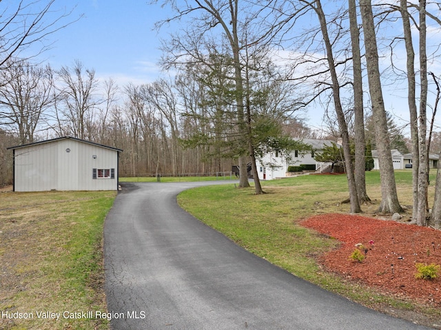 view of street featuring aphalt driveway