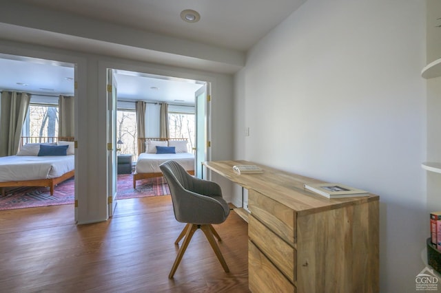 home office with wood finished floors