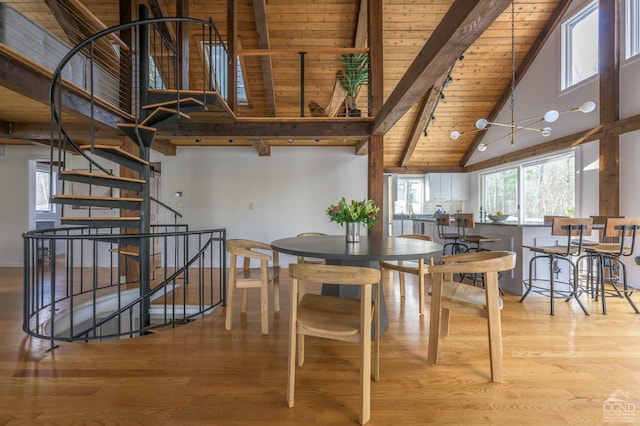 dining space featuring high vaulted ceiling, wooden ceiling, beamed ceiling, stairs, and wood finished floors