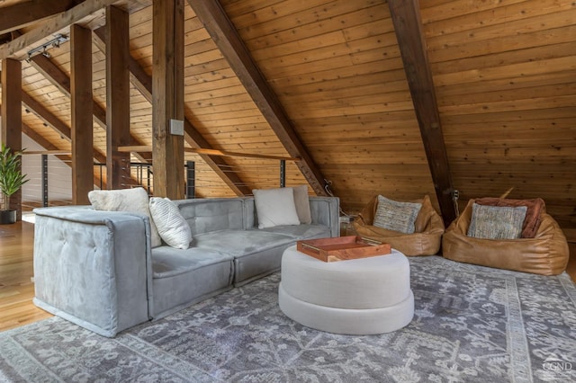 living area featuring wooden ceiling, wood finished floors, and wooden walls