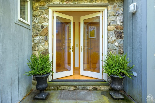 property entrance with stone siding