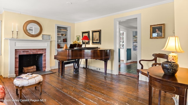 7 Paul Ave, Hudson, NY 12534 - living area with built in features, hardwood / wood-style floors, a fireplace, and ornamental molding