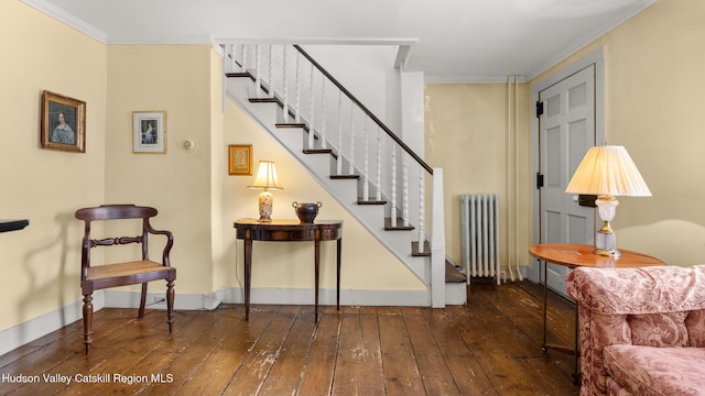 7 Paul Ave, Hudson, NY 12534 - staircase featuring radiator heating unit, wood-type flooring, and crown molding