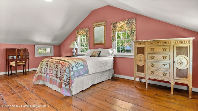 7 Paul Ave, Hudson, NY 12534 - bedroom featuring wood-type flooring, vaulted ceiling, and multiple windows