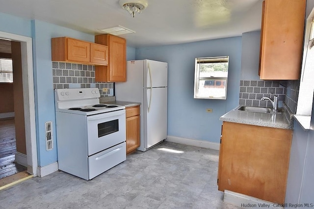 38 Emerick St, Kingston, NY 12401 - kitchen featuring white appliances, backsplash, and light countertops