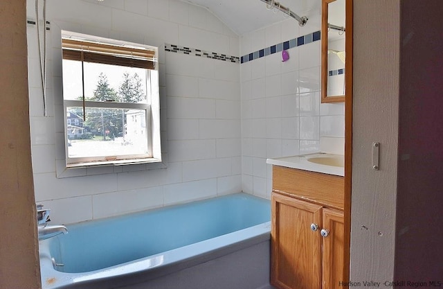 38 Emerick St, Kingston, NY 12401 - full bathroom featuring vanity, vaulted ceiling, and shower / tub combination