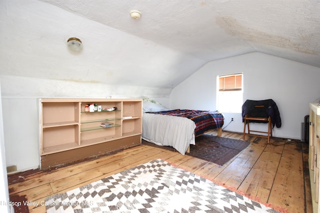 38 Emerick St, Kingston, NY 12401 - bedroom featuring wood-type flooring, lofted ceiling, and a textured ceiling