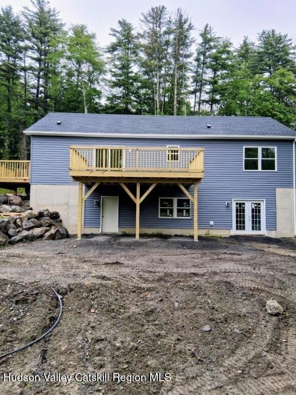 4791 US Highway 209, Accord, NY 12404 - view of front facade featuring a wooden deck, french doors, and view of scattered trees