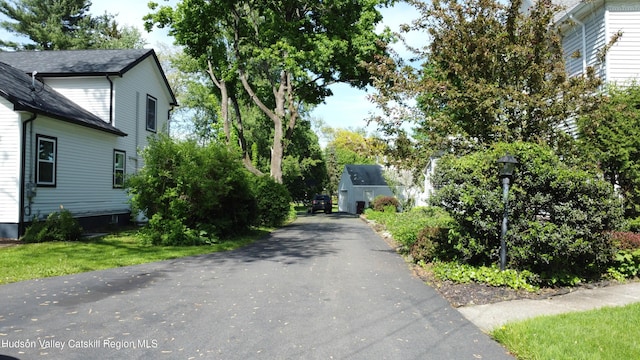 244 Jefferson Hts, Catskill, NY 12414 - view of asphalt driveway featuring street lighting