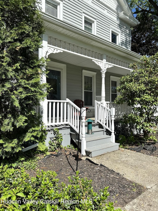 244 Jefferson Hts, Catskill, NY 12414 - doorway to property featuring covered porch