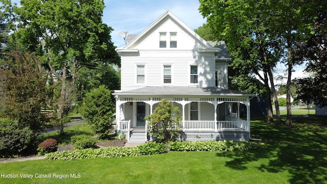 244 Jefferson Hts, Catskill, NY 12414 - view of front of property with covered porch, a front lawn, and roof with shingles