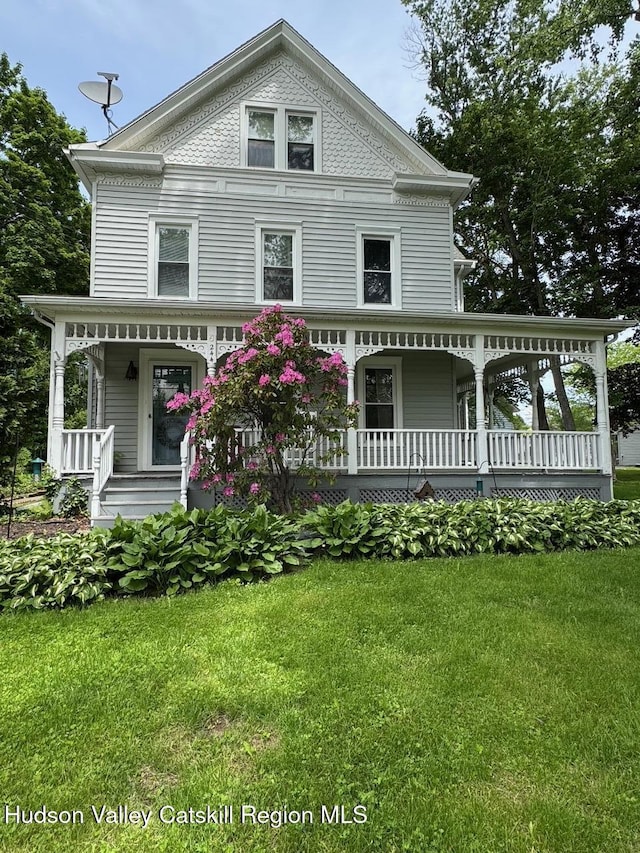 244 Jefferson Hts, Catskill, NY 12414 - view of front facade with covered porch and a front yard