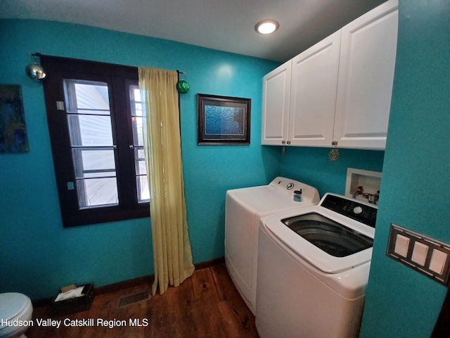 laundry room featuring washer and clothes dryer and dark wood-type flooring