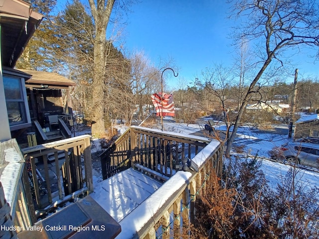 view of snow covered deck