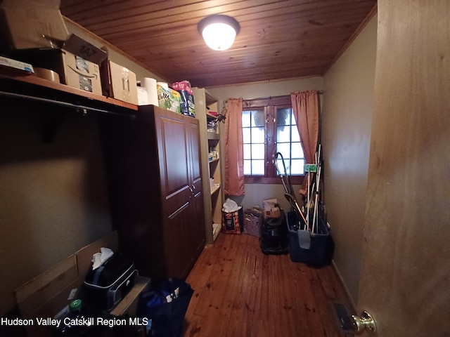 laundry room featuring hardwood / wood-style floors and wooden ceiling