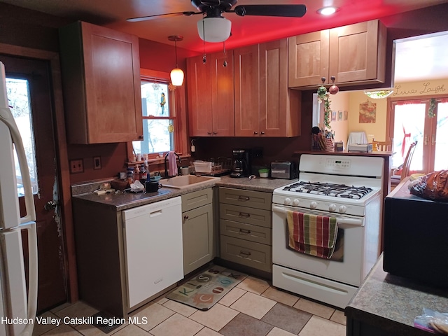 kitchen featuring white appliances, ceiling fan, sink, light tile patterned floors, and decorative light fixtures