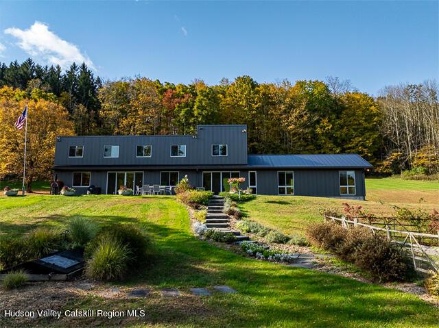 56 Winkelstern Ln, Kenoza Lake, NY 12750 - view of front of house with a front lawn and a view of trees