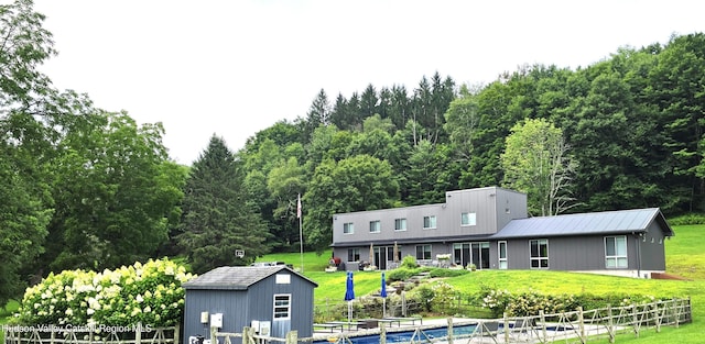 56 Winkelstern Ln, Kenoza Lake, NY 12750 - rear view of property with metal roof